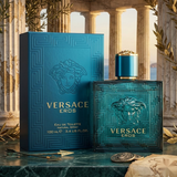 Versace Eros Eau de Toilette 3.4oz / 100ml for Men blue perfume bottle and matching box displayed in a luxurious Greek-inspired setting.