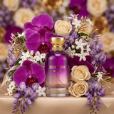 "Bharara Beauty Blossom Bouquet for Women EDP Spray 100ml perfume bottle displayed among purple and white flowers."