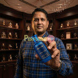 "Perfumes Stop owner holding a bottle of Bharara Double Bleu EDP Spray 100ml."