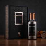 "A bottle of Bharara King Eau de Parfum with its matching black packaging box, featuring a simple rectangular design, set against a dark, elegant background with warm golden lighting."