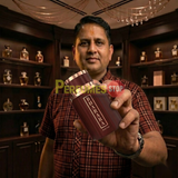 "Perfumes Stop owner holding a bottle of Bharara Musk Oud EDP Spray 3.4oz / 100ml for Men.