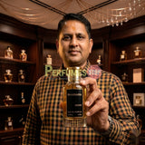 "Perfumes Stop owner holding a bottle of Bharara Niche Parfum Spray 100ml."