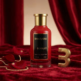 "Bharara Scarlet EDP Spray 100ml perfume bottle displayed against a red background."