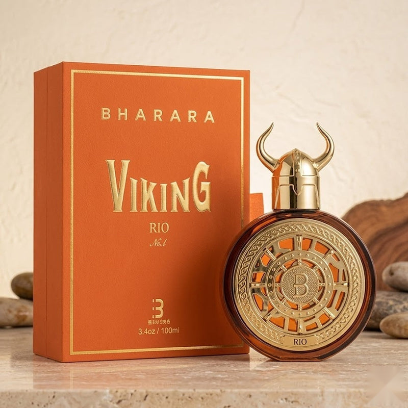 "A bottle of Bharara Viking Rio Parfum with its matching orange packaging box, featuring a gold watch-inspired bottle design, set against a soft orange and beige background with warm lighting."