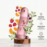 "Carolina Herrera 212 Heroes Forever Young perfume bottle displayed with raspberries, citrus fruits and decorative fragrance ingredients."