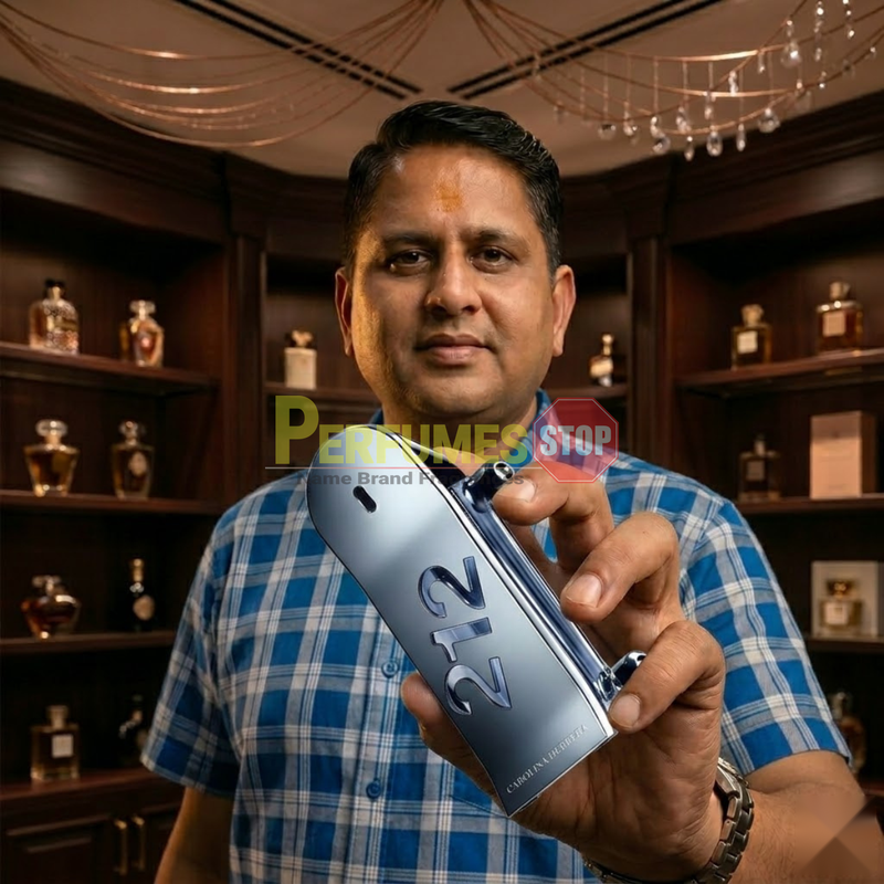 "Perfumes Stop owner holding a bottle of Carolina Herrera 212 MEN HEROES FOREVER YOUNG EDT Spray 3.0oz / 90ml."