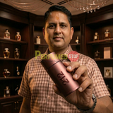 "Perfumes Stop owner holding a bottle of Carolina Herrera 212 MEN SEXY EDT Spray 3.4oz / 100ml."