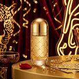 "Carolina Herrera 212 VIP Wild Party Limited Edition EDT Spray 2.7oz / 80ml gold perfume bottle displayed in an elegant decorative setting."