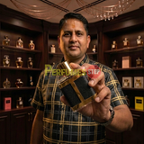 "Perfumes Stop owner holding a bottle of Carolina Herrera CH HC MEN LIMITED EDITION EDP Spray 3.4oz / 100ml."