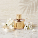 "Carolina Herrera CH Insignia Limited Edition EDP Spray 3.4oz / 100ml (WHITE) perfume bottle displayed in an elegant white and gold decorative setting."