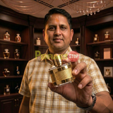 "Perfumes Stop owner holding a bottle of Carolina Herrera CH Insignia Limited Edition EDP Spray 3.4oz / 100ml (WHITE)."
