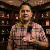 "Perfumes Stop owner holding a bottle of Carolina Herrera Good Girl Blush Elixir EDP Elixir Spray 2.7oz / 80ml."