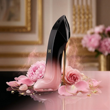 "Carolina Herrera Good Girl Blush Elixir EDP Elixir Spray 2.7oz / 80ml perfume bottle displayed with pink roses and decorative flowers."