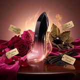 "Carolina Herrera Good Girl Blush Elixir perfume bottle displayed with roses, pink flowers and decorative fragrance ingredients."