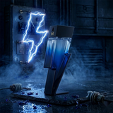"Carolina Herrera New York Bad Boy COBALT EDP Electrique Spray 3.4oz / 100ml perfume bottle displayed in a blue lightning-themed decorative setting."