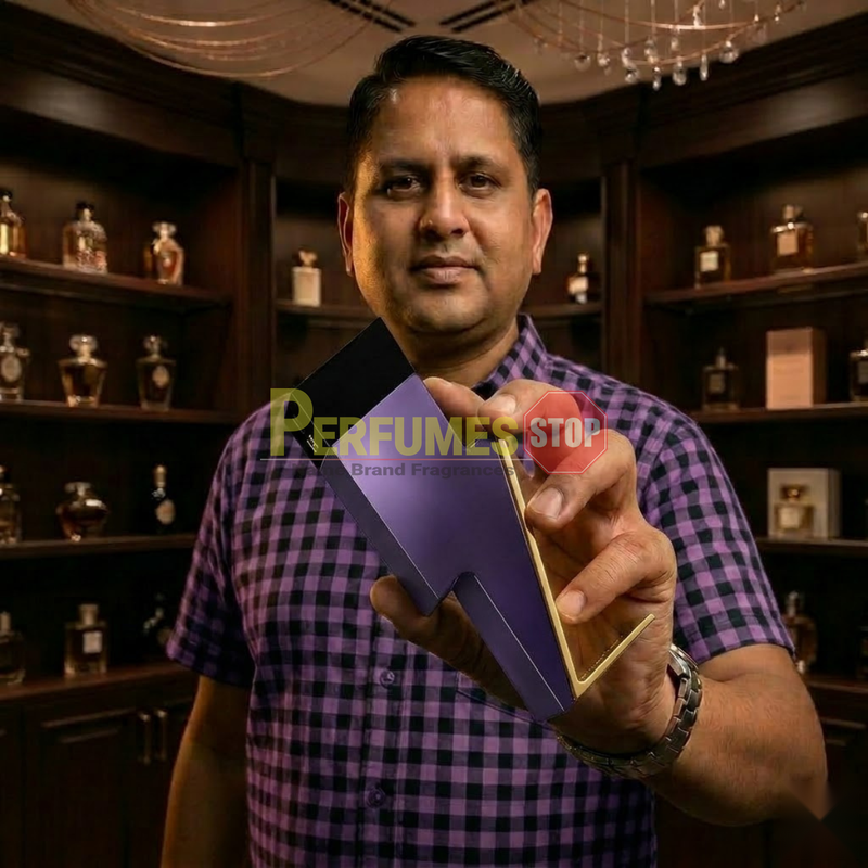 "Perfumes Stop owner holding a bottle of Carolina Herrera New York Bad Boy Dazzling Garden EDT Spray 3.4oz / 100ml."