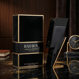 "Carolina Herrera New York Bad Boy EDT Spray 5.1oz / 150ml perfume bottle and matching black box."
