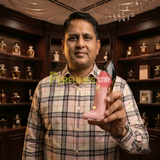 "Perfumes Stop owner holding a bottle of Carolina Herrera New York Good Girl Blush EDP Spray 2.7oz / 80ml."