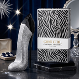 "Carolina Herrera New York Good Girl Superstars EDP Spray 2.7oz / 80ml perfume bottle and matching black and white zebra print box displayed in an elegant setting."