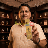 "Perfumes Stop owner holding a bottle of Creed Millesime Imperial Eau de Parfum"