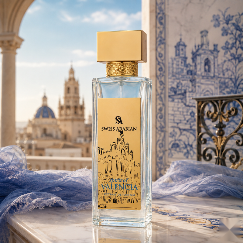 "A Creed Millesime Imperial perfume bottle with a gold cap and cream-colored label, set against a blue and white architectural background with soft natural lighting."