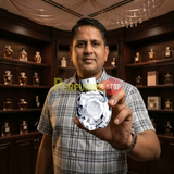 "Perfumes Stop owner holding a bottle of Emporio Armani Diamonds EDP Spray 3.4oz / 100ml."