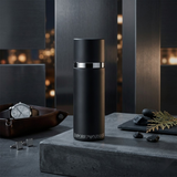 "Emporio Armani He Cologne for Men EDT Spray 3.4oz / 100ml perfume bottle displayed in a dark decorative setting."