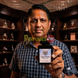 "Perfumes Stop owner holding a bottle of Lorenzo Pazzaglia Esco Pazzo Extrait de Parfum"
