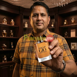 "Perfumes Stop owner holding a bottle of Giorgio Armani Acqua di Gio Arsol EDP.