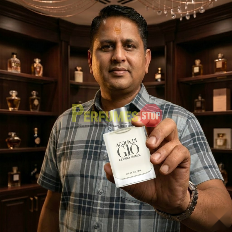 
"Perfumes Stop owner holding a bottle of Giorgio Armani Acqua di Gio EDT Spray 3.4oz / 100ml."