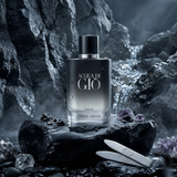 Giorgio Armani Acqua di Gio Parfum Spray Refillable 2.5oz / 75ml perfume bottle displayed in a dark, smoky setting."