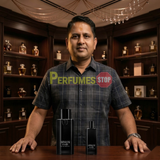 "Perfumes Stop owner holding a bottle of Giorgio Armani Armani Code 2pcs Set EDT Spray (4.2oz + 0.5oz)."