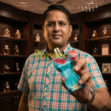 "Perfumes Stop owner holding a bottle of Jean Paul Gaultier La Belle Paradise Garden EDP Spray 3.4oz / 100ml."