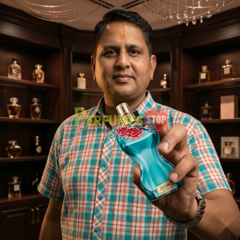 "Perfumes Stop owner holding a bottle of Jean Paul Gaultier La Belle Paradise Garden EDP Spray 3.4oz / 100ml."