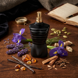 "Jean Paul Gaultier Le Male Le Parfum perfume bottle displayed with lavender, spices and decorative fragrance accessories."