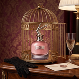"Jean Paul Gaultier Scandal EDP Spray 2.7oz / 80ml perfume bottle displayed in an elegant decorative setting."