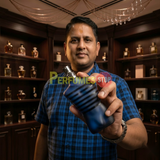 "Perfumes Stop owner holding a bottle of Jean Paul Gaultier Ultra Male EDT Intense Spray 4.2oz / 125ml."