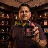 "Perfumes Stop owner holding a bottle of Lorenzo Pazzaglia Choco Raptor Extrait de Parfum"