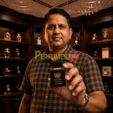 "Perfumes Stop owner holding a bottle of Lorenzo Pazzaglia Dark Florum Extrait de Parfum"