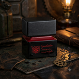 "A black perfume bottle labeled 'Gasoleather' by Lorenzo Pazzaglia, featuring a red label and black cap, set against a dark, elegant background with leather, flowers, and warm golden lighting."