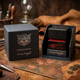 "A bottle of Lorenzo Pazzaglia Gasoleather Extrait de Parfum with its matching black packaging box, featuring a gold butterfly graphic and red label, set against a dark, elegant background with warm lighting."