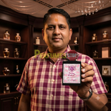 "Perfumes Stop owner holding a bottle of Lorenzo Pazzaglia Sugar Kisses Extrait de Parfum"