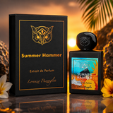 "A bottle of Lorenzo Pazzaglia Summer Hammer Extrait de Parfum with its matching black packaging box, featuring a gold butterfly graphic and colorful label, set against a dark tropical background with warm golden lighting."