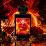 A black perfume bottle labeled 'X Sweet Possession' with a red and orange label, set against a dramatic background of flames, a glass of amber liquid, red roses, and spices. The bottle is centered and highly polished, with a reflection below.