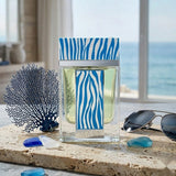 "Mast Ocean Life Pour Homme EDP Spray 3.4oz / 100ml blue perfume bottle displayed on a table near a window."