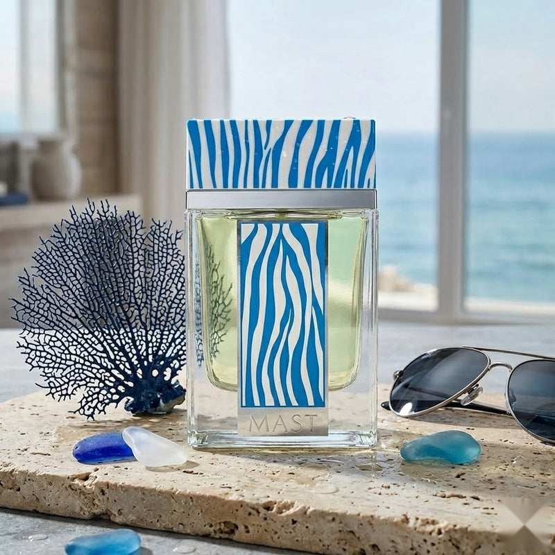 "Mast Ocean Life Pour Homme EDP Spray 3.4oz / 100ml blue perfume bottle displayed on a table near a window."