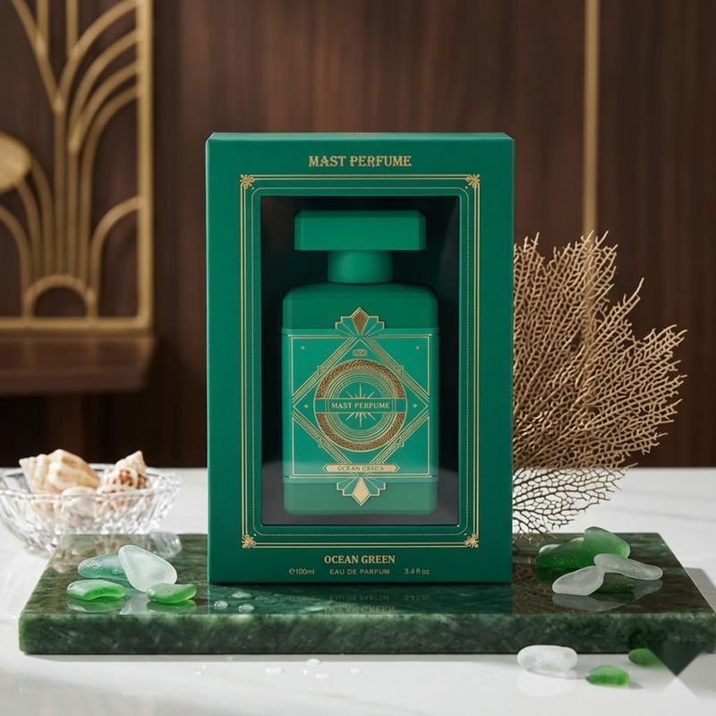 "Mast Parfume Ocean Green perfume bottle surrounded by green foliage, flowers, spices and fragrance ingredients."