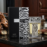 "Mast Wild Life Pour Homme perfume bottle and branded box displayed with fragrance ingredients and a decorative background."