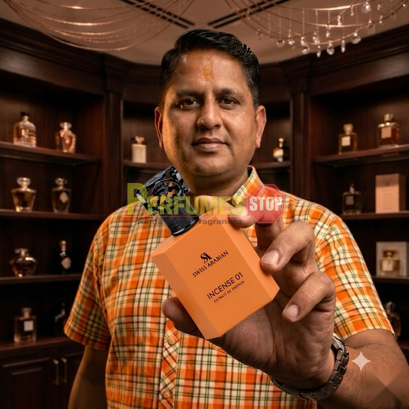 "Perfumes Stop owner holding a bottle of Swiss Arabian Incense 01 Extrait de Parfum"
