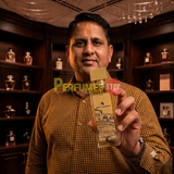 "Perfumes Stop owner holding a bottle of Swiss Arabian Passion of Venice Extrait de Parfum"